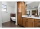 Bathroom features a soaking tub, wood cabinets and quartz countertop at 18116 N 14Th St, Phoenix, AZ 85022
