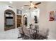 Dining room with a glass table, comfortable chairs, and a view into the game room at 18116 N 14Th St, Phoenix, AZ 85022