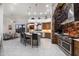 Spacious kitchen with a large island, stainless steel appliances, and stone accent wall at 18116 N 14Th St, Phoenix, AZ 85022