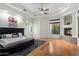 Spacious main bedroom featuring wood floors, a fireplace, and a modern decor at 18116 N 14Th St, Phoenix, AZ 85022