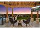 Inviting outdoor patio area with comfortable seating, a flat-screen TV, and beautiful views of the city at 18116 N 14Th St, Phoenix, AZ 85022
