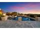 Backyard pool has beautiful water features, pillars, and stunning sunset views at 18116 N 14Th St, Phoenix, AZ 85022