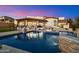 Stunning backyard pool with cascading waterfall feature and basketball hoop, perfect for entertaining at 18116 N 14Th St, Phoenix, AZ 85022