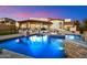 Stunning backyard pool with cascading waterfall feature and basketball hoop, perfect for entertaining at 18116 N 14Th St, Phoenix, AZ 85022