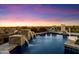 Pool features stone pillars, waterfalls, and city views, creating a serene and inviting outdoor space at 18116 N 14Th St, Phoenix, AZ 85022