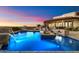 Stunning pool area with waterfall features and an elevated spa, perfect for relaxing and enjoying the view at 18116 N 14Th St, Phoenix, AZ 85022