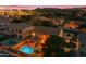 Backyard aerial view showcasing pool, outdoor living area and beautiful string lights at 18460 E Peachtree Blvd, Queen Creek, AZ 85142