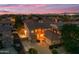 Stunning aerial view of a luxurious two-story home at twilight with well-maintained landscaping at 18460 E Peachtree Blvd, Queen Creek, AZ 85142
