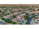 Wide aerial view of a residential community with many desert homes and manicured landscaping at 18460 E Peachtree Blvd, Queen Creek, AZ 85142
