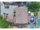 Aerial view of property showcasing roof, putting green, large backyard with patio and pool at 18460 E Peachtree Blvd, Queen Creek, AZ 85142