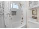 Clean bathroom featuring shower-over-tub with decorative tile and modern fixtures, offering a spa-like experience at 18460 E Peachtree Blvd, Queen Creek, AZ 85142
