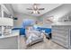 Comfortable bedroom with gray walls, blue accents, a ceiling fan, and carpet flooring at 18460 E Peachtree Blvd, Queen Creek, AZ 85142