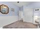 Bedroom with neutral carpet, ample closet space, and soothing blue walls, creating a tranquil and organized living area at 18460 E Peachtree Blvd, Queen Creek, AZ 85142