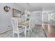 Elegant dining space with seating for ten and decorative chandelier at 18460 E Peachtree Blvd, Queen Creek, AZ 85142