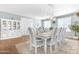 Bright dining room with a large china cabinet and a spacious table with seating for ten at 18460 E Peachtree Blvd, Queen Creek, AZ 85142