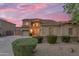 Charming two-story home featuring a three-car garage and meticulously maintained landscaping at 18460 E Peachtree Blvd, Queen Creek, AZ 85142