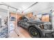 Tidy garage with storage cabinets, a modern vehicle, and ample space for organization at 18460 E Peachtree Blvd, Queen Creek, AZ 85142