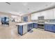 Spacious kitchen with stainless steel appliances, a center island, and ample counter space at 18460 E Peachtree Blvd, Queen Creek, AZ 85142