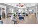 Open-concept living room provides ample seating, a wine fridge, and connects to the kitchen, perfect for entertaining at 18460 E Peachtree Blvd, Queen Creek, AZ 85142