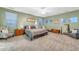 Spacious main bedroom with king bed, accent chairs, and a neutral color palette providing a peaceful and calming retreat at 18460 E Peachtree Blvd, Queen Creek, AZ 85142