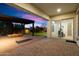 Lovely outdoor living space with stone patio, fire pit, and a view of the manicured yard at 1874 E Crescent Way, Chandler, AZ 85249