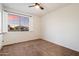 Bedroom showcasing carpet floors, baseboard trim, window with shutters, and neutral walls at 1874 E Crescent Way, Chandler, AZ 85249