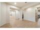 Neutral living area with tile flooring, white walls, and multiple entryways at 1874 E Crescent Way, Chandler, AZ 85249