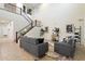 Inviting living room features high ceilings, staircase, modern furniture, and decorative art at 1874 E Crescent Way, Chandler, AZ 85249