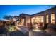 Backyard showcasing a fire pit, outdoor kitchen, and dining area under a covered patio with desert landscaping at 1903 N Lynch --, Mesa, AZ 85207
