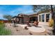 Serene backyard showcases a fire pit area, dining area, and covered outdoor kitchen perfect for outdoor living at 1903 N Lynch --, Mesa, AZ 85207