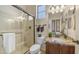 Well-lit bathroom with granite counters, a glass shower, and modern fixtures at 1903 N Lynch --, Mesa, AZ 85207