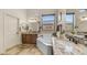 Luxurious bathroom with dual sinks, a soaking tub, and modern fixtures at 1903 N Lynch --, Mesa, AZ 85207