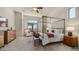 Spacious bedroom features a four-poster bed, natural light, and elegant decor at 1903 N Lynch --, Mesa, AZ 85207
