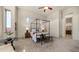 Bright bedroom with a four-poster bed, neutral colors, and views of the neighborhood at 1903 N Lynch --, Mesa, AZ 85207