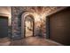 Inviting courtyard entrance with a wrought iron gate, stone accents, and access to the home's entrance at 1903 N Lynch --, Mesa, AZ 85207