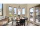 Bright dining area featuring large windows with scenic views and stylish lighting to create an inviting atmosphere at 1903 N Lynch --, Mesa, AZ 85207