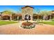 Desert community entrance featuring a beautiful flower bed, landscaping, and stone work at 1903 N Lynch --, Mesa, AZ 85207