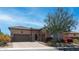 Charming single-story home featuring a stone facade, tile roof, well-manicured landscaping, and a two-car garage at 1903 N Lynch --, Mesa, AZ 85207