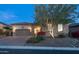 Charming single-story home featuring a stone facade, tile roof, well-manicured landscaping, and a two-car garage at 1903 N Lynch --, Mesa, AZ 85207