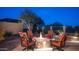 Outdoor fire pit with comfortable seating offers a cozy gathering spot surrounded by beautiful desert landscaping at 1903 N Lynch --, Mesa, AZ 85207