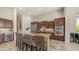 Spacious kitchen featuring a large island with seating, custom cabinetry, and stainless steel appliances at 1903 N Lynch --, Mesa, AZ 85207