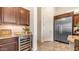 Modern kitchen showcasing granite countertops, a wine fridge, stainless steel appliances, and custom cabinets at 1903 N Lynch --, Mesa, AZ 85207