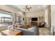 Bright living room features large windows, a ceiling fan, and stylish furnishings, creating a welcoming space at 1903 N Lynch --, Mesa, AZ 85207