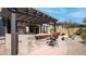 Backyard with a covered outdoor kitchen with bar seating, perfect for enjoying the outdoors at 1903 N Lynch --, Mesa, AZ 85207