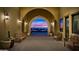 Covered desert walkway with desert views, wooden benches, and potted plants at 1903 N Lynch --, Mesa, AZ 85207