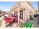 Comfortable seating and grill area in backyard with gravel and artificial turf at 19815 N 49Th Ave, Glendale, AZ 85308
