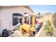 Backyard area with a grill, comfortable seating, and desert landscaping, perfect for outdoor enjoyment at 19815 N 49Th Ave, Glendale, AZ 85308