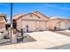 Attractive single-story house with a two-car garage featuring desert landscaping and a healthy saguaro cactus at 19815 N 49Th Ave, Glendale, AZ 85308