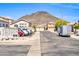 Community street view showcases a mix of single-Gathering homes, desert landscaping, and a backdrop of scenic mountains at 19815 N 49Th Ave, Glendale, AZ 85308