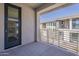 Private balcony with sleek railings offers views of the community and surrounding landscape at 2121 W Sonoran Desert Dr # 21, Phoenix, AZ 85085